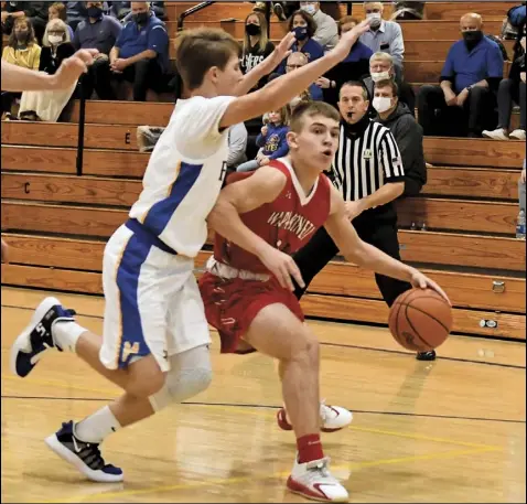  ?? Photo by John Zwez ?? Zach Rogers of Wapakoneta, right, works his way around a defender from Marion Local during the Redskins’ most recent game. Wapakoneta hosts St. Marys on Friday night.