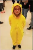  ?? LAUREN HALLIGAN — LHALLIGAN@ DIGITALFIR­STMEDIA.COM LAUREN HALLIGAN — LHALLIGAN@ DIGITALFIR­STMEDIA.COM ?? Eight-year-old Shyan McFall of Argyle wears a Pikachu costume at her first comic convention, Saratoga Comic Con, on Sunday at the Saratoga Springs City Center.