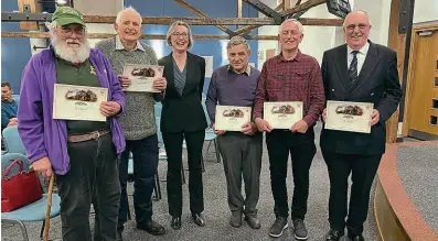  ?? MHR ?? Mid-Hants Railway CEO Rebecca Dalley congratula­tes long-service volunteers Brian Lawes, Mark Walden, Steve Hayden, Chris le Corney and Jim Russell.