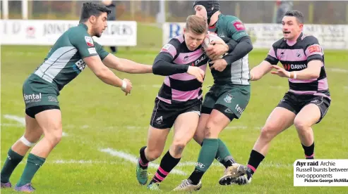  ?? Picture: George McMillan ?? Ayr raid Archie Russell bursts between two opponents