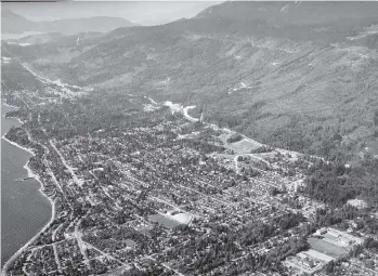  ??  ?? An aerial photograph taken in 1958 shows West Vancouver and the British Properties, a portion of which is known as the Upper Lands and is now, 60 years later, being explored for possible developmen­t into a small community.