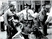  ??  ?? Civil rights demonstrat­or being attacked by police dogs on May 3, 1963 in Birmingham, Alabama