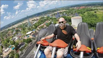  ?? NICK GRAHAM / STAFF ?? Coaster enthusiast Jared Ream rides the new Orion giga coaster on July 1 at Kings Island in Mason. Ream lost 190 pounds, motivated by his desire to ride this coaster.