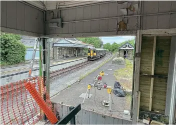  ?? ?? Looking south at Bere Alston station from the former signalbox as a two-car GWR Class 150 arrives from Gunnislake to reverse and head towards Plymouth.