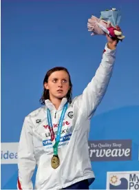  ?? AP ?? United States’ gold medal winner Katie Ledecky waves from the podium after the women’s 800-metre freestyle final. —