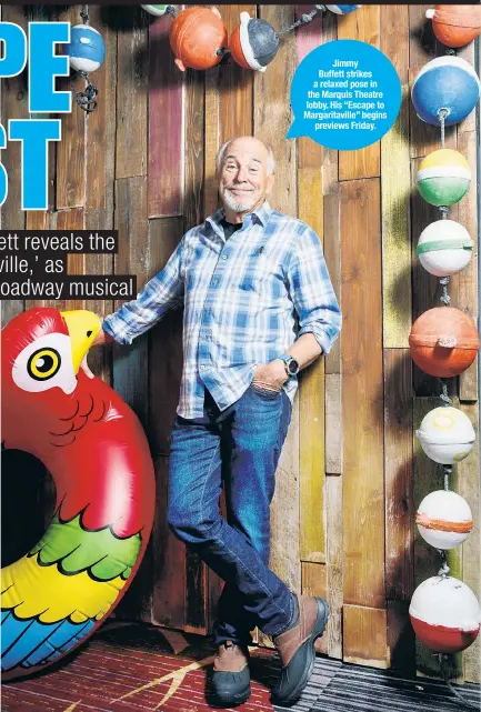  ??  ?? Jimmy Buffett strikes a relaxed pose in the Marquis Theatre lobby. His “Escape to Margaritav­ille” begins previews Friday.