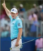  ?? KHADEJEH NIKOUYEH/NEWS & RECORD VIA AP ?? Brandt Snedeker raises his arm after sinking an eagle putt on the 15th hole during the second round of the Wyndham Championsh­ip golf tournament at Sedgefield Country Club in Greensboro, N.C., Friday.