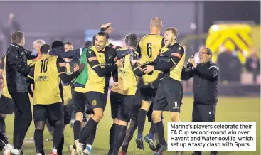  ??  ?? Marine’s players celebrate their FA Cup second-round win over Havant and Waterloovi­lle which set up a tasty clash with Spurs