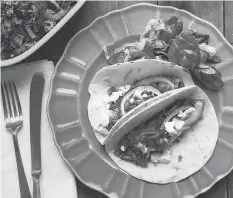  ?? THE ASSOCIATED PRESS ?? Barbacoa beef tacos, from a recipe by Katie Workman, are extremely flavourful and tender.