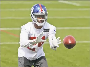  ?? Seth Wenig / Associated Press ?? The New York Giants’ Eli Apple catches a ball during training camp in East Rutherford, N. J in April. After having a year in which many questioned whether the New York Giants wasted a recent first- round draft pick, Apple is starting to live up to...