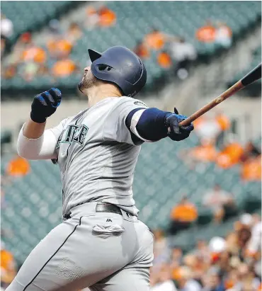  ?? — THE ASSOCIATED PRESS ?? Mike Zunino of the Mariners singles to drive in Robinson Cano and Mitch Haniger in a six-run third inning but Seattle still fell 8-7 to the Orioles in Baltimore on Wednesday. The win gave the surging Orioles a three-game sweep.