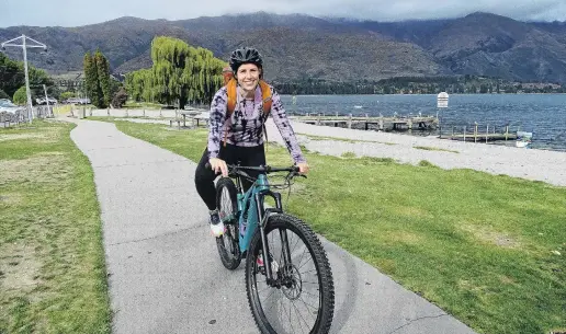  ?? PHOTO: KERRIE WATERWORTH ?? Home . . . Anna Ross enjoys delivering orders of nail polish and lipstick on her bike in Wanaka.