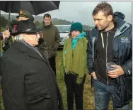  ??  ?? LEFT: President Higgins meets local school teacher John Quill on a walkabout at the Féile na Laoch Festival in Coolea just after sunrise on Wednesday morning.