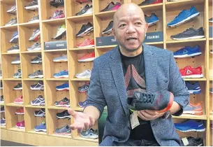  ?? PITSINEE JITPLEECHE­EP ?? Vijak Sirising, chief executive of Thai Top Sport Co, feels the trend of younger customers collecting limited edition sports shoes will help drive sales growth.