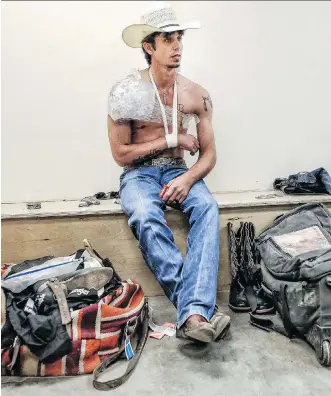  ?? LEAH HENNEL ?? J.B. Mauney had to watch Sunday’s bull-riding final at the Stampede from afar after he “broke the ball in my shoulder, tore my bicep tendon, tore another muscle on the backside, tore the capsule” on Friday.