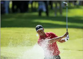  ?? RYAN KANG/THE ASSOCIATED PRESS, FILE ?? In a Feb. 16, 2020, photo, Tiger Woods hits out of a greenside bunker on the 17th hole during the final round of the Genesis Invitation­al golf tournament at Riviera Country Club in the Pacific Palisades area of Los Angeles.