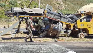  ??  ?? MANGLED: A helicopter crashed on the Worcester side of Du Toitskloof Pass. It is understood the chopper struck overhead power cables. There were no fatalities.