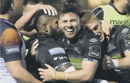  ??  ?? 0 Glasgow scrum-half Ali Price, centre, celebrates a try for his side during the 34-10 victory over Edinburgh at Scotstoun last weekend.