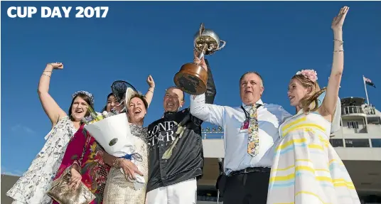  ?? PHOTO: JOSEPH JOHNSON/STUFF ?? Mark Purdon celebrates with owners Philip and Glenys Kennard and their daughters after the Cup presentati­on.