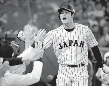  ?? Masterpres­s Getty Images ?? SHOHEI OHTANI is just 23 and brings from Japan a powerful combinatio­n of hitting and pitching. The Angels fell just short of the playoffs this year, and with a couple more moves they could challenge the AL’s best.