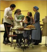  ?? SUBMITTED PHOTOS ?? Motel (Colin Camp) shows off his new sewing machine (and new baby!) to his mother-in-law Golde (Sue Mangold), sisters-in-law Bielke (Charlotte Storch), Shprintze (Alyssa Bridges) and Chava (Emily Jones) as wife Tzeitel (Becky Cooper) looks on.