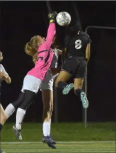  ?? PETE BANNAN — DIGITAL FIRST MEDIA ?? Garnet Valley goalkeeper Kayleigh Saboja punches away a header attempt by Strath Haven’s Cayden Frazier Tuesday night. Saboja made 10 saves to help the Jaguars earn a 0-0 draw in double overtime.