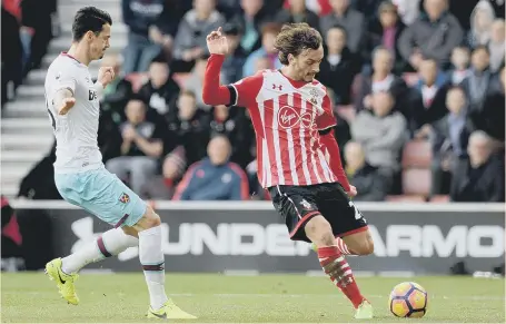  ??  ?? Sunderland up next: Debutant striker Manolo Gabbiadini slams home Southampto­n’s opener in Saturday’s 3-1 defeat at home to West Ham