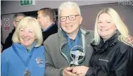  ??  ?? Presentati­on Mr and Mrs Pisaneschi were presented with their Car of the Year trophy by Clare Fuller from Douglas Park MINI