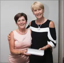  ??  ?? Patricia Slattery, a prize winner in the Lady Captain’s Prize competitio­n at Blainroe Golf Club, receives her prize from Lady Captain Tina Meehan.