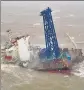  ?? AP ?? A cargo ship broken in half in the South China Sea, 300km south of Hong Kong.
