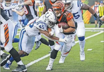  ??  ?? Colts linebacker E.J. Speed (45) tackles Bengals running back Rodney Anderson (33) during Thursday's preseason game in Cincinnati. [AP PHOTO/FRANK VICTORES]