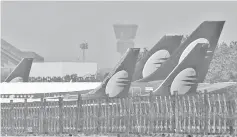  ??  ?? Jet Airways aircrafts are seen parked at the Chhatrapat­i Shivaji Maharaj Internatio­nal Airport in Mumbai, India. — Reuters photo