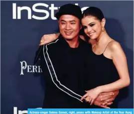 ??  ?? Actress-singer Selena Gomez, right, poses with Makeup Artist of the Year Hung Vanngo.