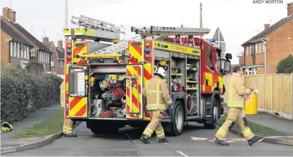  ?? ANDY MORTON ?? DUMPED: Crews at the scene of an incident in Blaby where a leaking chemical container had been left in the street