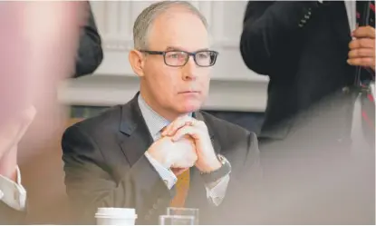  ?? AP ?? Scott Pruitt, the former head of the Environmen­tal Protection Agency, tried to kill tougher fuel- efficiency standards for vehicles.