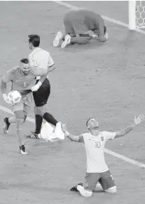  ??  ?? Brazil’s Neymar, right, celebrates, as his teammate, goalkeeper Weverton, with ball, races to join him after Brazil defeated Germany for the Olympic soccer gold medal in Rio on Saturday. Brazil won on penalty shootouts, with Neymar scoring the decisive...