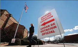  ?? LMOTERO/AP ?? Asign inboth English and Spanish directs voters to a polling location during early voting in Dallas. Campaigns generally air Spanishlan­guage ads to lure Latino voters, even though the majority of Latino eligible voters speak English as their main language.