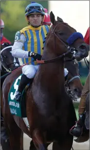  ?? (Arkansas Democrat-Gazette/Thomas Metthe) ?? Jockey Joel Rosario rode Nadal to his fourth consecutiv­e victory Saturday in the second leg of the Arkansas Derby at Oaklawn in Hot Springs.