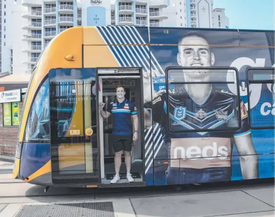  ?? Picture: JAMES DONISON ?? Jarrod Wallace on one of the Titans-branded G:link trams, which will feature the faces and voices of Wallace, Anthony Don and AJ Brimson.