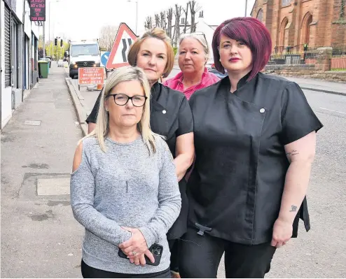  ?? ?? Worried shop owners in Wishaw fear cyclists are putting lives at risk