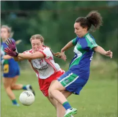  ??  ?? Ciara Stokes of Tinahely gets a block in on Jessie McElhron of AGB.