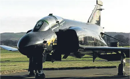  ?? Picture: Dougie Nicolson. ?? British F4 Phantom Aviation Group members spent 11 months dismantlin­g the plane.