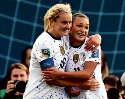  ?? ANDREW CORNAGA/ASSOCIATED PRESS ?? Lindsey Horan (left) celebrates her goal with Sophia Smith, who scored two of her own.