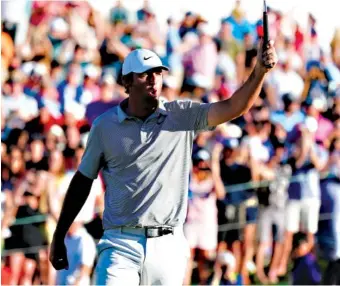  ?? AP PHOTO/ROSS D. FRANKLIN ?? Scottie Scheffler shouts as he celebrates his birdie putt on the third playoff hole during the final round of the Phoenix Open on Sunday in Scottsdale, Ariz.