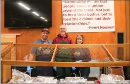  ?? DANIELLE RAY — SENTINEL & ENTERPRISE ?? Left to right, a trio of Our Father’s Table volunteers Michael Santucci, Ed Kukkula, and Debbie Santucci , plate up the prime rib meal served at the Fitchburg community outreach program’s 40th anniversar­y celebratio­n last month.