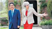  ??  ?? Theresa May shows her Japanese counterpar­t Shinzo Abe around Chequers yesterday