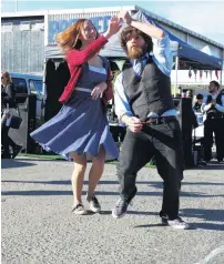  ?? PHOTO: DANIEL BIRCHFIELD ?? Slick moves . . . Charlotte King and Kieran Ford, both of Dunedin, give a swing dance demonstrat­ion at the Harbour St Jazz and Blues Festival in Oamaru yesterday.