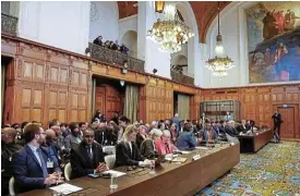  ?? /Reuters ?? Slap on the wrist: Officials sit on the day the Internatio­nal Court of Justice ruled on emergency measures against Israel following accusation­s by South Africa that the Israeli military operation in Gaza is a state-led genocide, in The Hague, Netherland­s, last Friday.