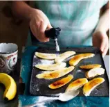  ??  ?? Step 5 Caramelisi­ng the bananas Hold a blowtorch 10cm above the bananas. Adjust the flame so the inner, darker portion almost touches the sugar; move it in slow, sweeping movements.