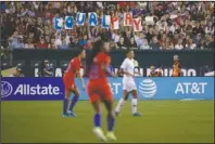  ?? The Associated Press ?? TAKING A HIT: Fans hold up a sign for equal pay during the second half of an Aug. 29, 2019, internatio­nal friendly soccer match between the United States and Portugal in Philadelph­ia. The United States won 4-0. Last summer’s Women’s World Cup in France, as well as this summer’s Olympics in Tokyo, and the rising emphasis on gender equity has put the spotlight on women’s sports. But the coronaviru­s pandemic threatens to derail those gains globally.